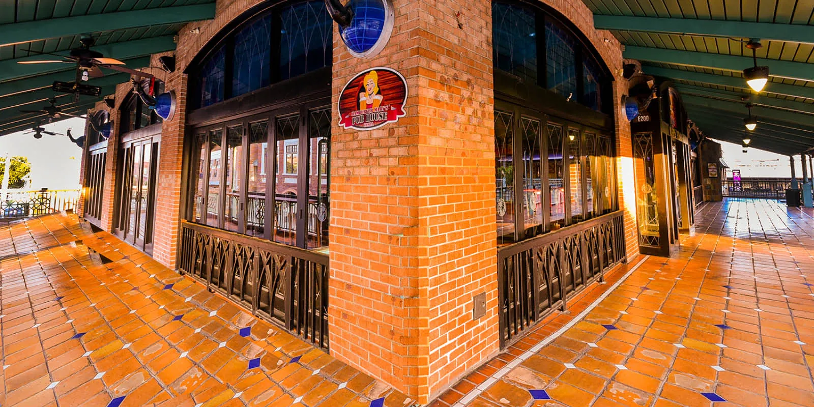 Interior of a historic Ybor City building with brick columns and arches