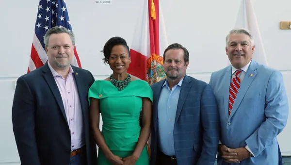 Officials posing together at Port Tampa Bay's military appreciation event