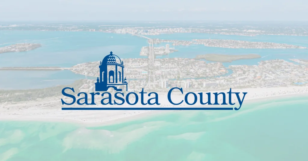 Sarasota County logo over an aerial photo of the coastline