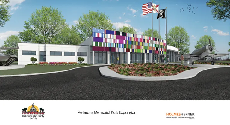 Concept drawing for Veterans Memorial Park Expansion, featuring a white building, large driveway with massive flag poles, tanks, helicopters and retired army equipment scattered throughout the grounds