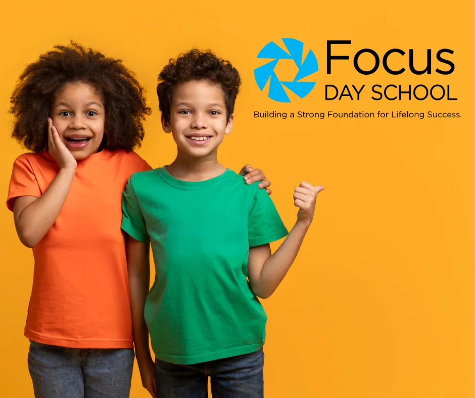 Two children giving a thumbs up next to the Focus Day School logo and tagline