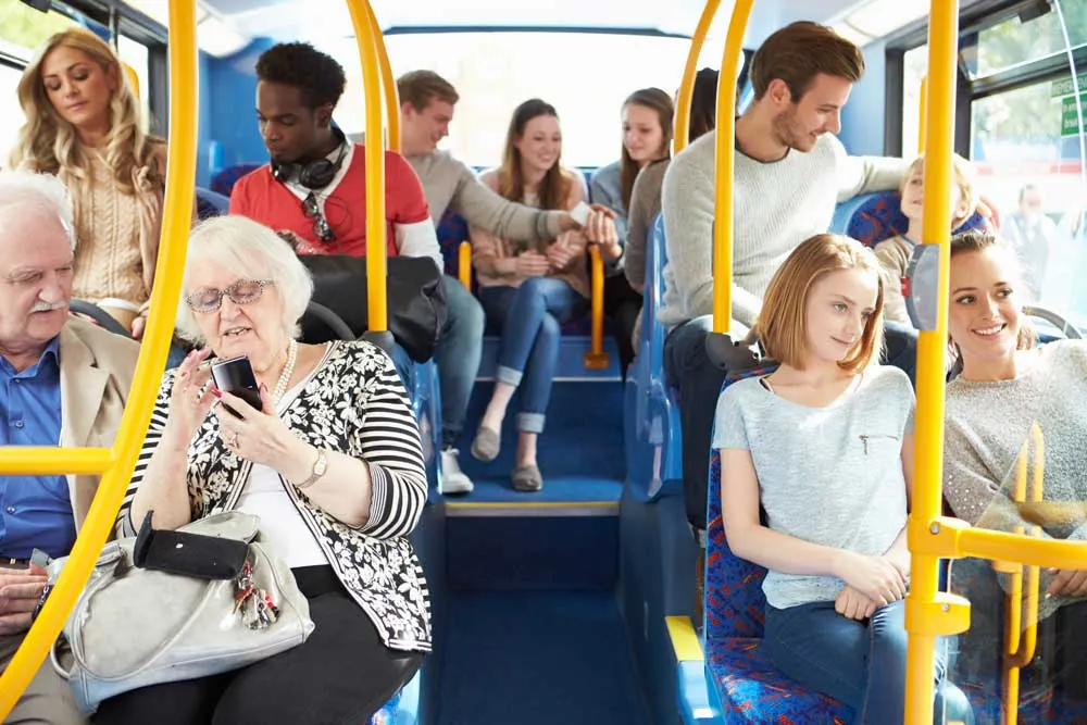 Passengers riding a public transit bus