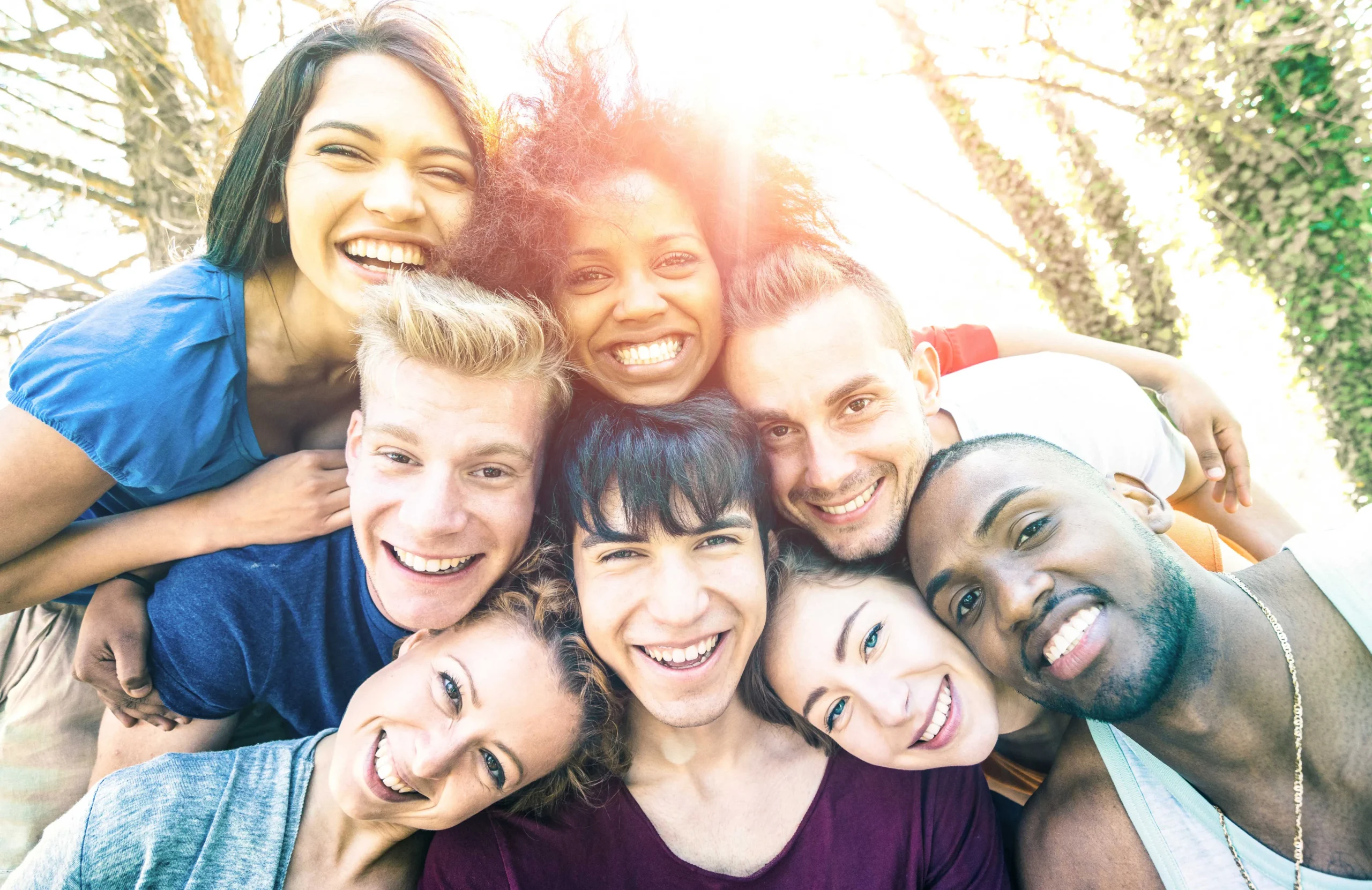 Group of friends smiling together outdoors