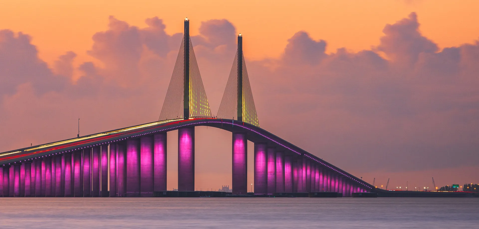 Sunshine Skyway Bridge at sunset lit up in pink