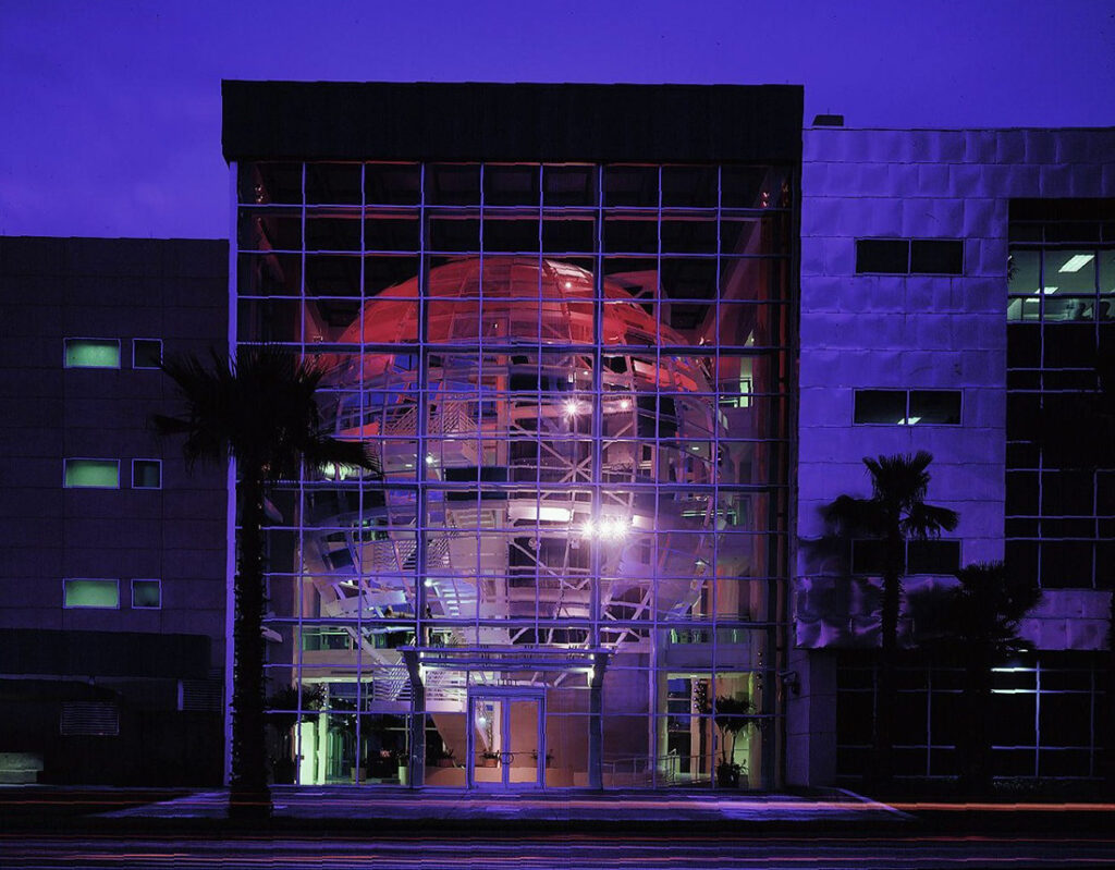 Port Tampa Bay building illuminated in blue light at night