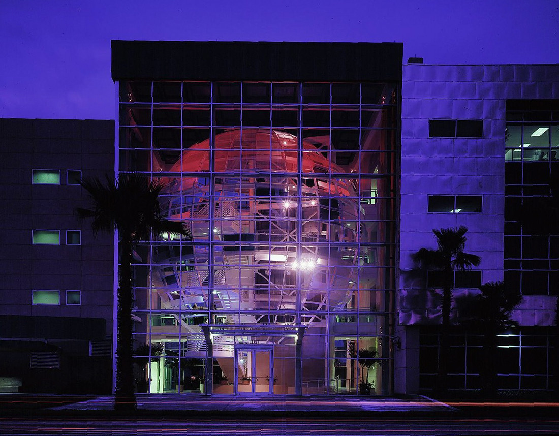 Port Tampa Bay building illuminated in blue light at night
