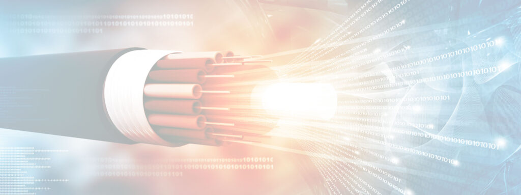 Fiber optic cable glowing with light, representing Kuducom's internet service