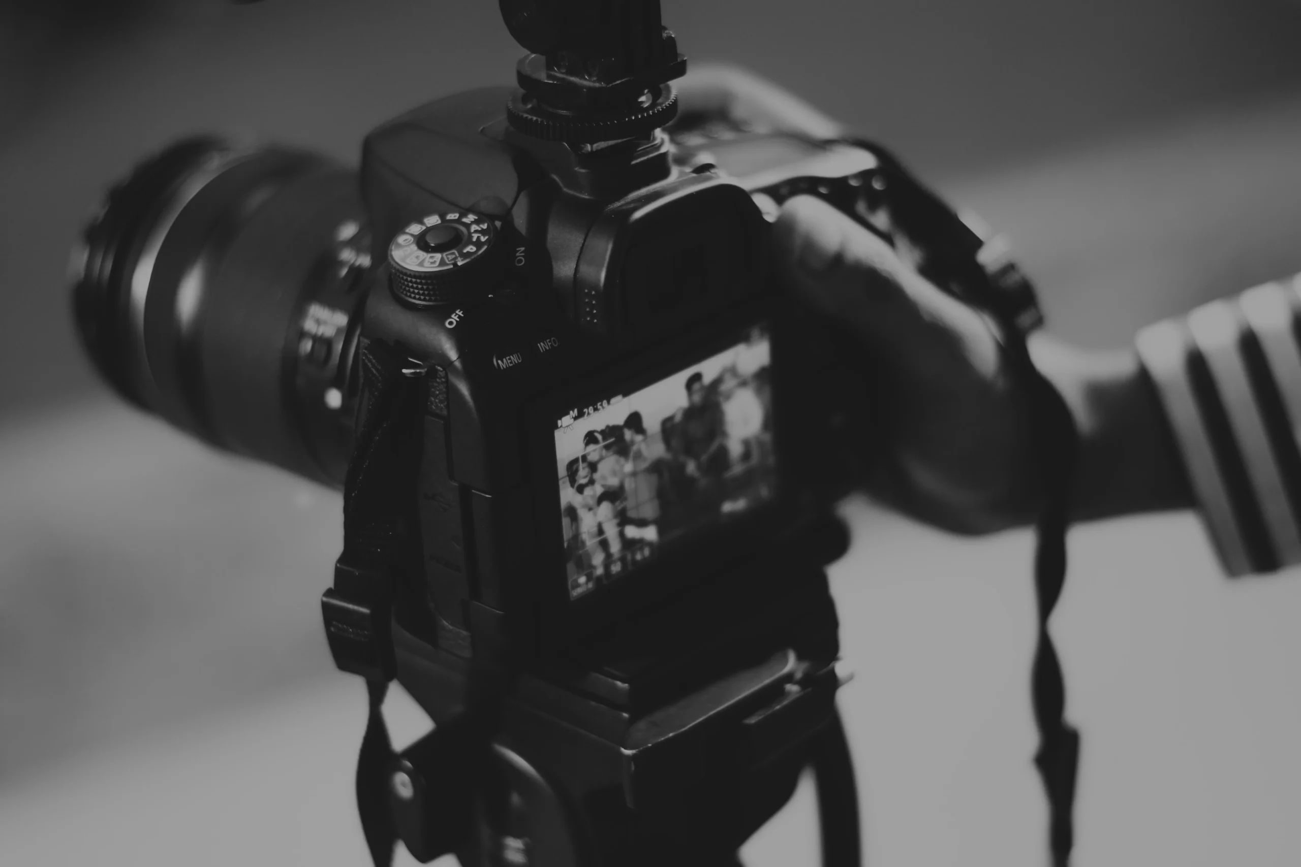 Hand adjusting a professional video camera