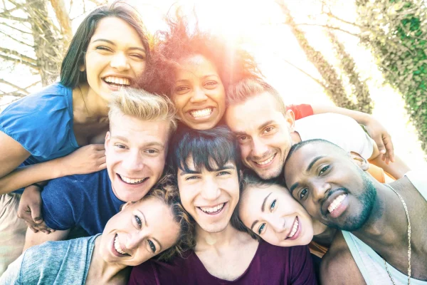 Group of friends smiling together outdoors