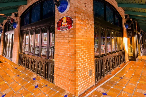 Interior of a historic Ybor City building with brick columns and arches
