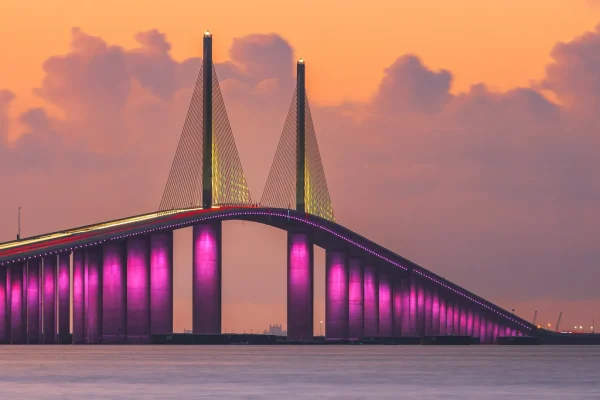 Sunshine Skyway Bridge at sunset lit up in pink