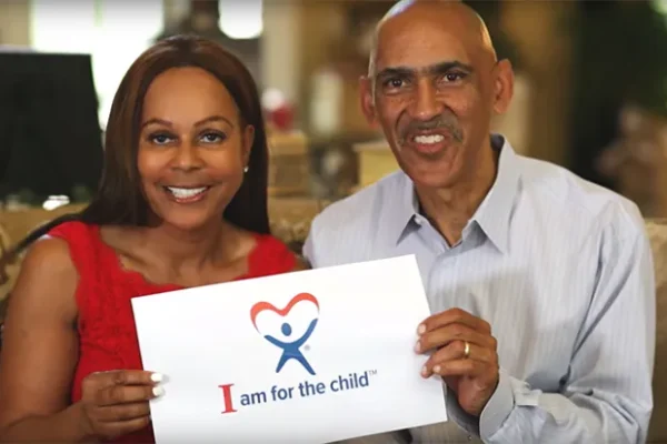 Foster Parents Lauren and Tony Dungy talking about their support of the Guardian ad Litem Program