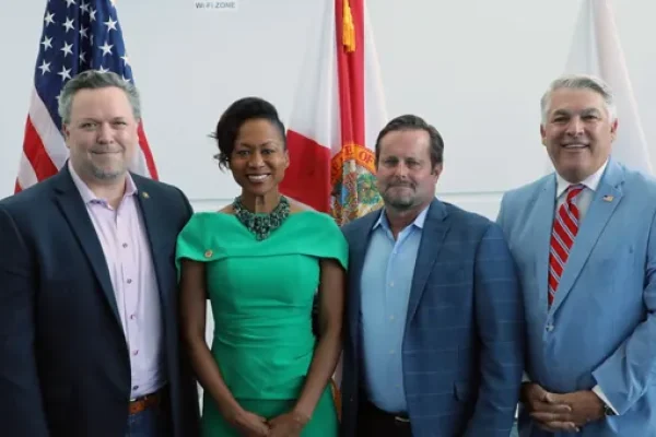 Officials posing together at Port Tampa Bay's military appreciation event