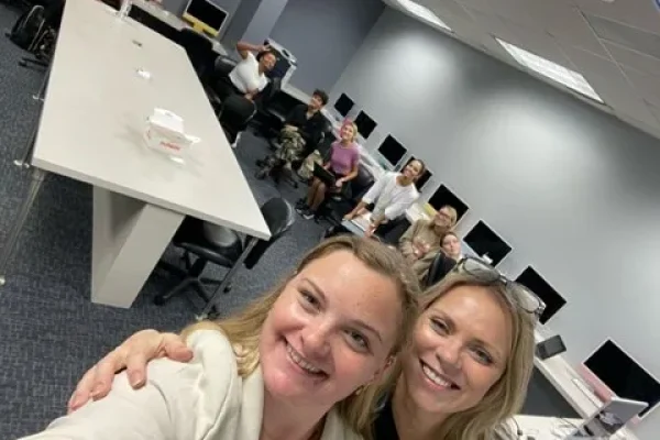 Two colleagues taking a selfie in the HCP Associates office